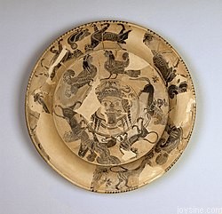 250px Gorgon Painter Attic Black Figure Plate with Gorgon's Head and Bands of Animals Walters 48215.jpg